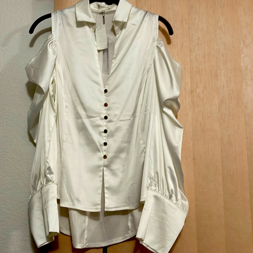 Long sleeve cold off shoulder blouse with puffed sleeve.